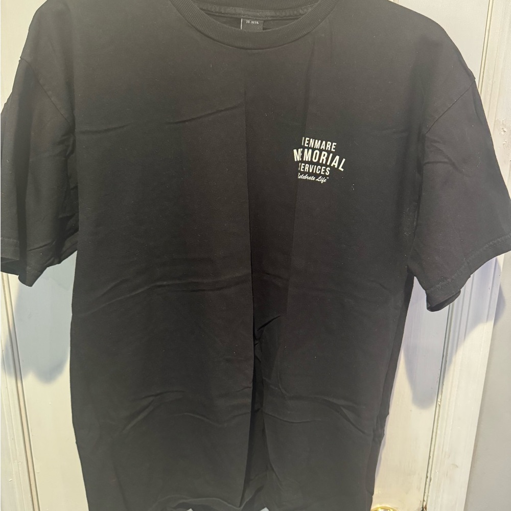 10.Deep Black Memorial Services Graphic Tee with White Chest Print